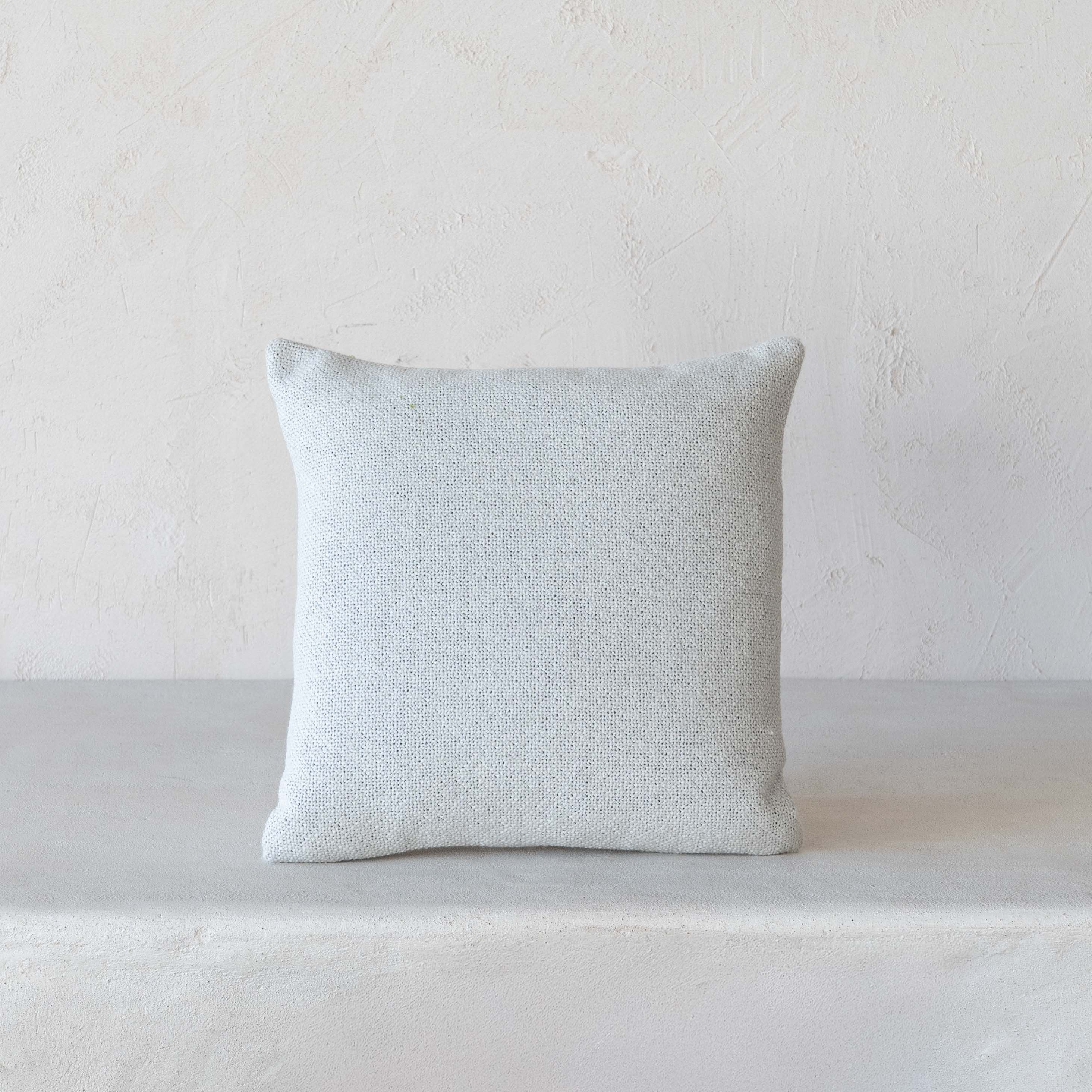 Minimalist linen cushion in Dubai home
