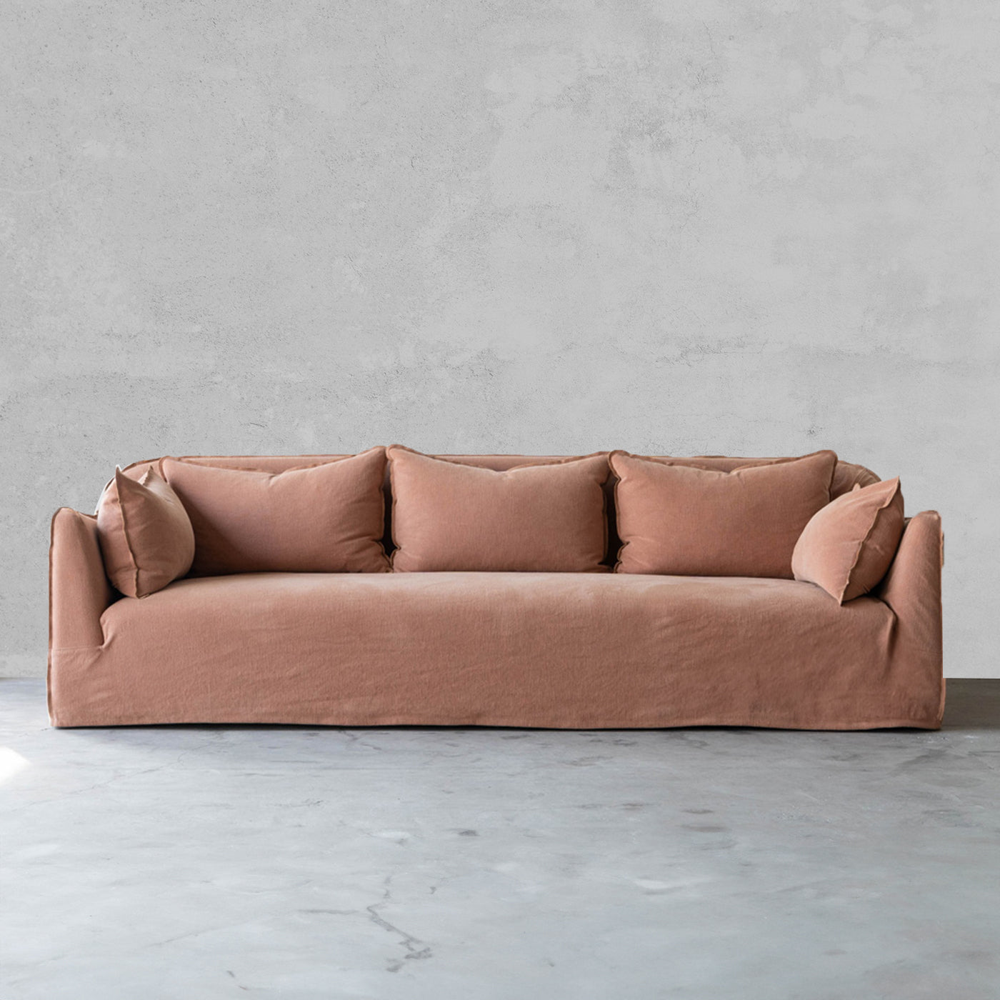 Brown sofa against a gray wall