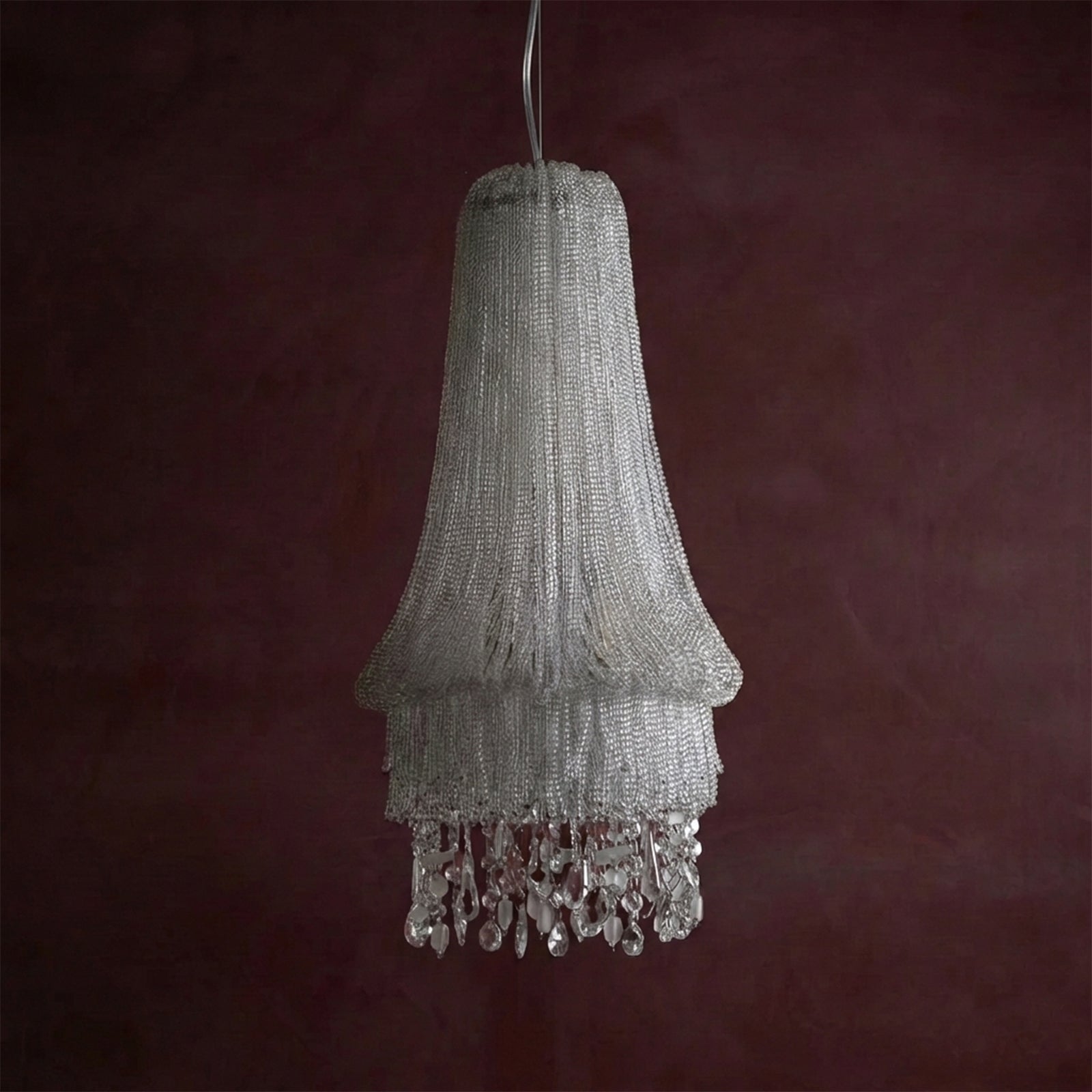 Beaded chandelier against a dark red background